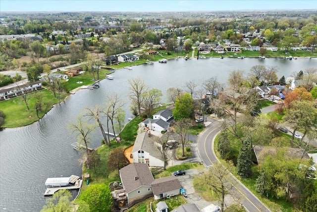 drone / aerial view featuring a residential view and a water view