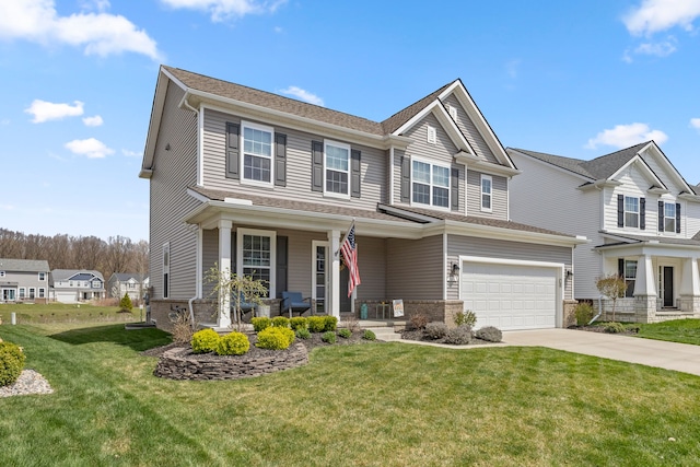 craftsman-style home featuring a garage, a front lawn, covered porch, and concrete driveway