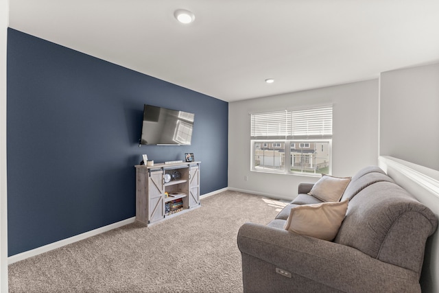 living room featuring carpet floors and baseboards