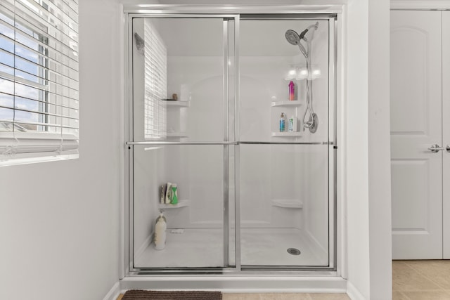 full bath featuring a shower stall