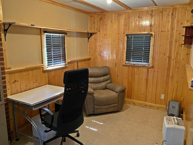 office area with wood walls and tile patterned floors