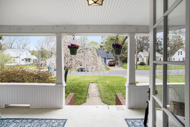 view of patio with a residential view and covered porch