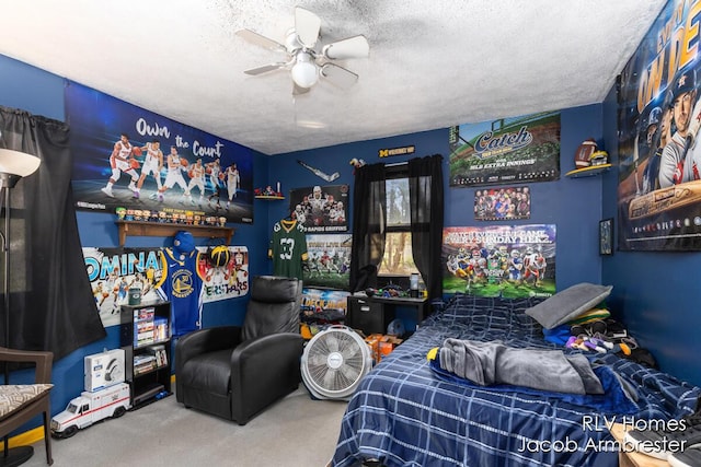 carpeted bedroom with a ceiling fan and a textured ceiling