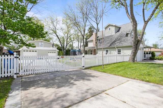 7891 Robindale Ave, Dearborn Heights, MI 48127 - view of front of home with a detached garage and a shingled roof