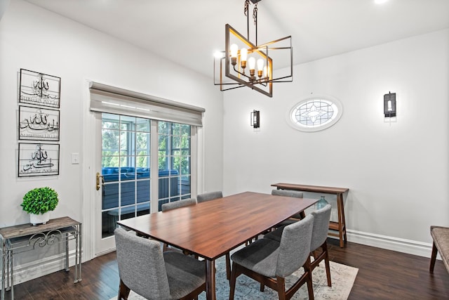 7891 Robindale Ave, Dearborn Heights, MI 48127 - dining area with dark wood finished floors, baseboards, and a chandelier