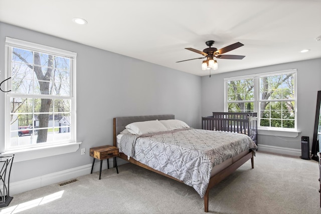 7891 Robindale Ave, Dearborn Heights, MI 48127 - carpeted bedroom featuring multiple windows, baseboards, recessed lighting, and a ceiling fan