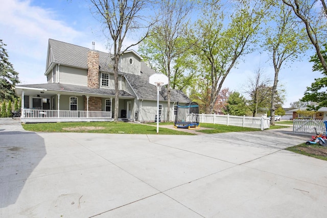 7891 Robindale Ave, Dearborn Heights, MI 48127 - view of front facade featuring covered porch, a chimney, and driveway