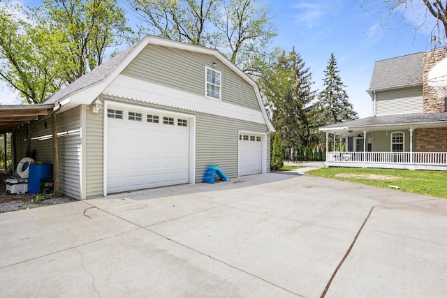 7891 Robindale Ave, Dearborn Heights, MI 48127 - garage featuring a porch and concrete driveway