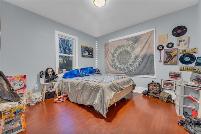 bedroom with wood finished floors