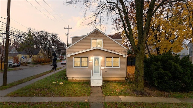 bungalow-style house with entry steps