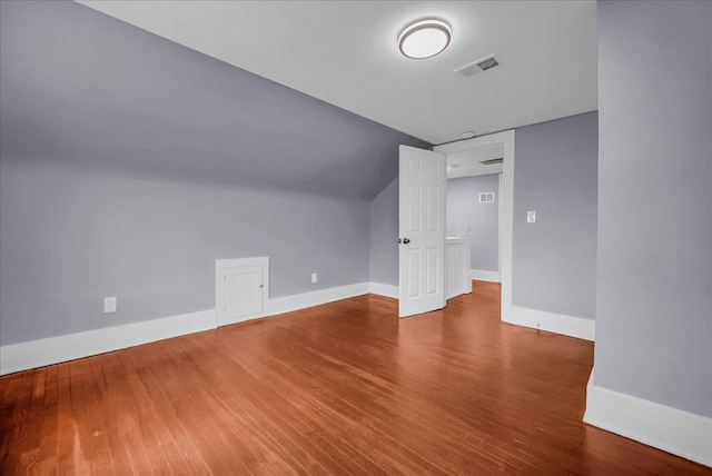 3690 Phillips Ave, Berkley, MI 48072 - additional living space featuring baseboards, visible vents, wood finished floors, and lofted ceiling
