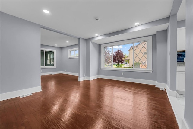 3690 Phillips Ave, Berkley, MI 48072 - unfurnished living room with wood-type flooring, recessed lighting, baseboards, and visible vents