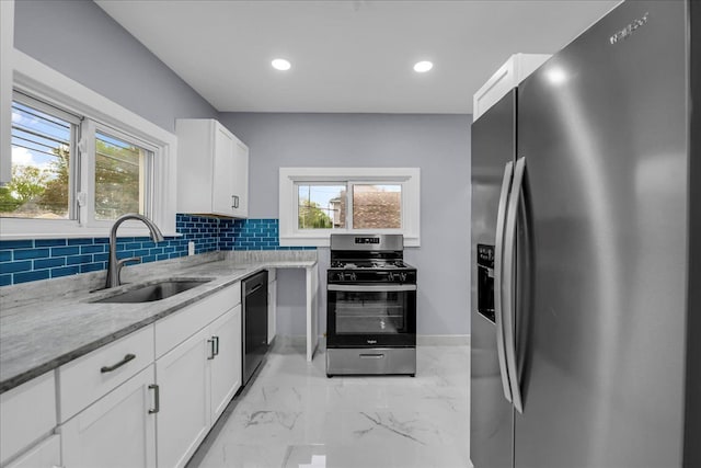 3690 Phillips Ave, Berkley, MI 48072 - kitchen featuring decorative backsplash, marble finish floor, light stone counters, a sink, and stainless steel appliances
