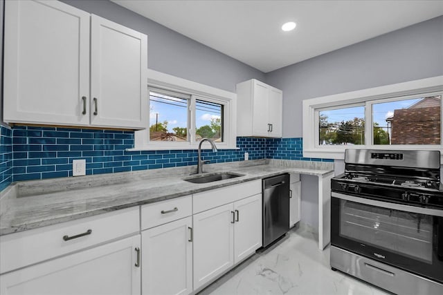 3690 Phillips Ave, Berkley, MI 48072 - kitchen with a sink, a wealth of natural light, stainless steel appliances, and marble finish floor