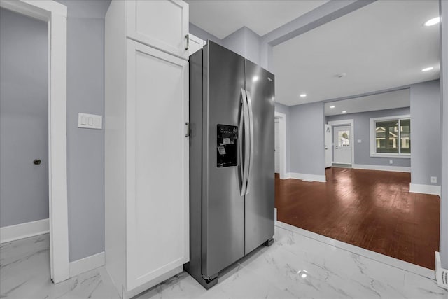 3690 Phillips Ave, Berkley, MI 48072 - kitchen featuring white cabinets, stainless steel fridge with ice dispenser, marble finish floor, recessed lighting, and baseboards