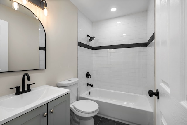 full bath with tile patterned flooring, vanity, toilet, bathing tub / shower combination, and recessed lighting