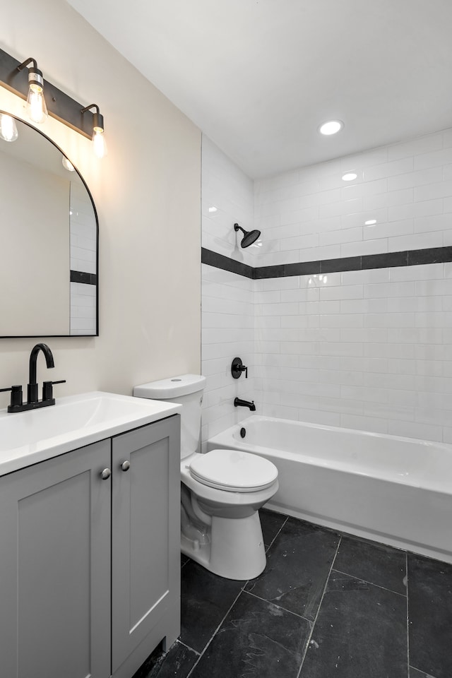 full bath featuring tile patterned flooring, vanity, toilet, washtub / shower combination, and recessed lighting
