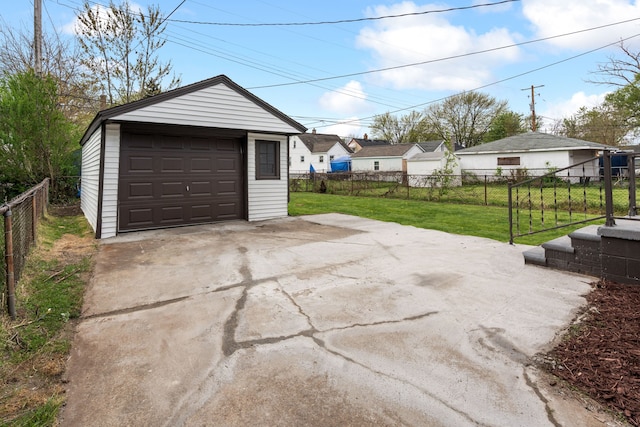 detached garage featuring fence