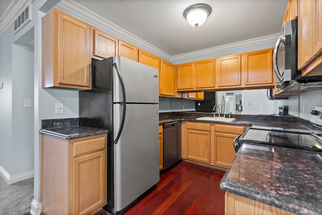 kitchen with dark wood-style flooring, visible vents, appliances with stainless steel finishes, a sink, and ornamental molding