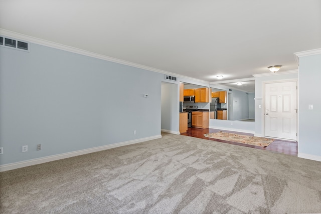 unfurnished living room featuring crown molding, carpet floors, and visible vents