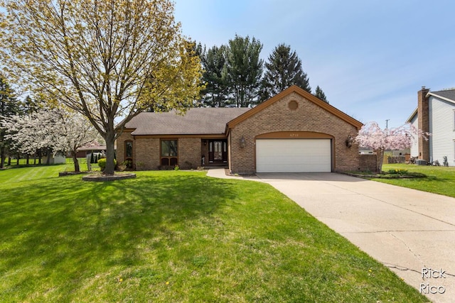 single story home with brick siding, driveway, a front yard, and a garage