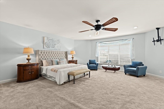 bedroom with ceiling fan, carpet flooring, and baseboards
