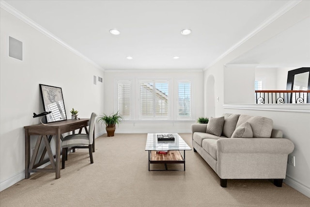 living room featuring plenty of natural light, baseboards, and ornamental molding