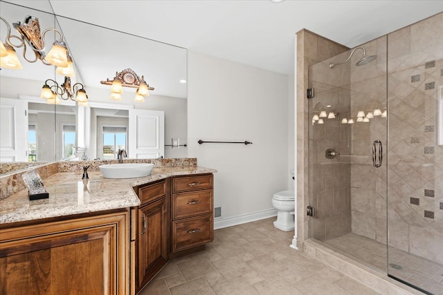 full bathroom featuring a stall shower, toilet, and baseboards