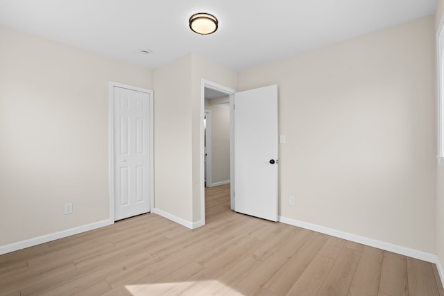 23130 Beverly St, Saint Clair Shores, MI 48082 - unfurnished bedroom featuring light wood-style flooring, baseboards, and a closet