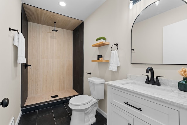 23130 Beverly St, Saint Clair Shores, MI 48082 - bathroom featuring tile patterned flooring, toilet, vanity, baseboards, and a tile shower