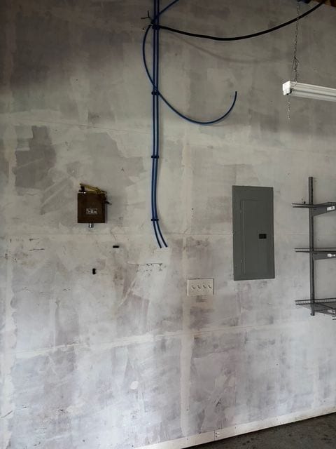 utility room featuring electric panel