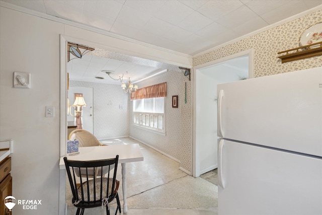7309 N Genesee Rd, Genesee, MI 48437 - kitchen featuring crown molding, freestanding refrigerator, and wallpapered walls