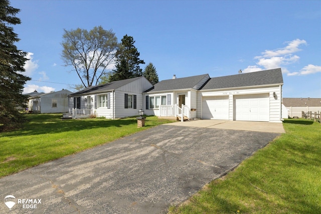 7309 N Genesee Rd, Genesee, MI 48437 - ranch-style house featuring an attached garage, driveway, and a front lawn