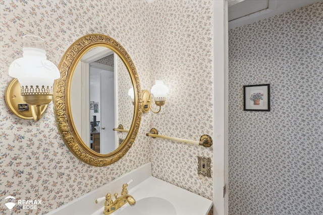 7309 N Genesee Rd, Genesee, MI 48437 - bathroom featuring a sink and wallpapered walls