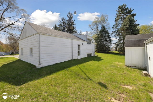 7309 N Genesee Rd, Genesee, MI 48437 - view of home's exterior featuring a yard, an outbuilding, a chimney, and a shed