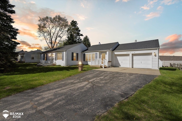 7309 N Genesee Rd, Genesee, MI 48437 - ranch-style house with a garage, driveway, and a front yard