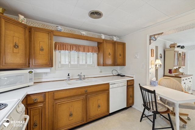 7309 N Genesee Rd, Genesee, MI 48437 - kitchen featuring a sink, brown cabinets, white appliances, and light countertops