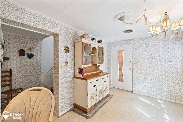 7309 N Genesee Rd, Genesee, MI 48437 - interior space with crown molding, a chandelier, wallpapered walls, baseboards, and visible vents