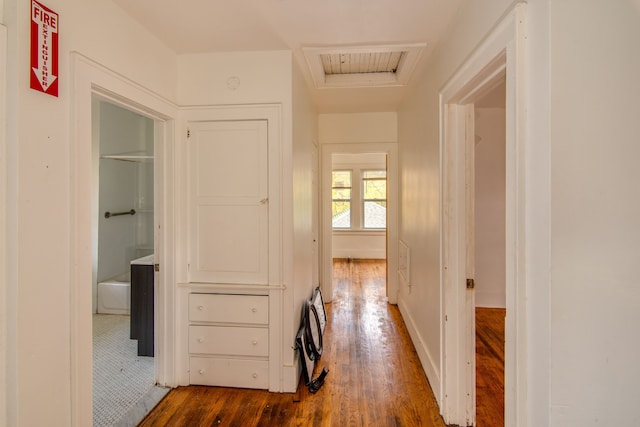 1636 N Grand Traverse St, Flint, MI 48503 - hall featuring baseboards, attic access, and dark wood-style flooring