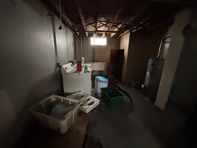 basement featuring washing machine and dryer and electric water heater