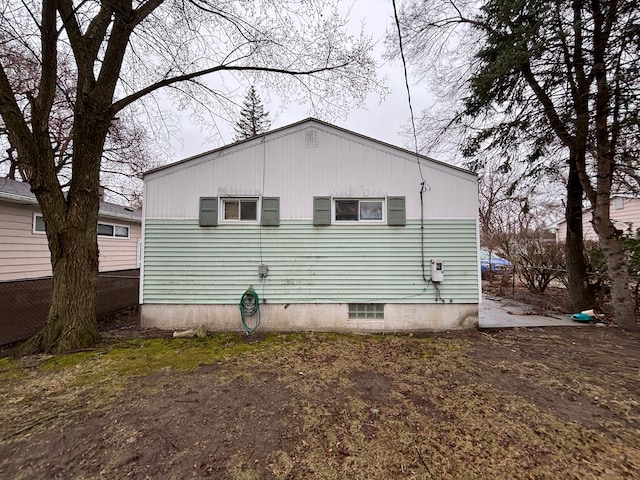 back of property with fence