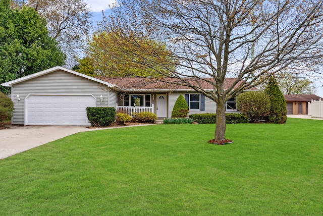 single story home featuring a front lawn, driveway, covered porch, and an attached garage