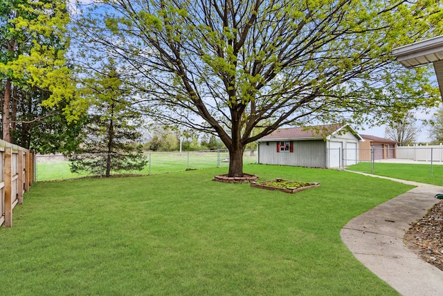 view of yard featuring an outbuilding and a fenced backyard