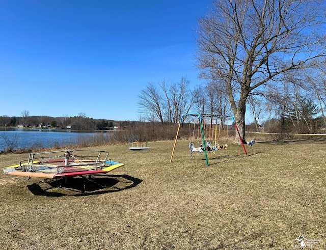 view of jungle gym with a water view