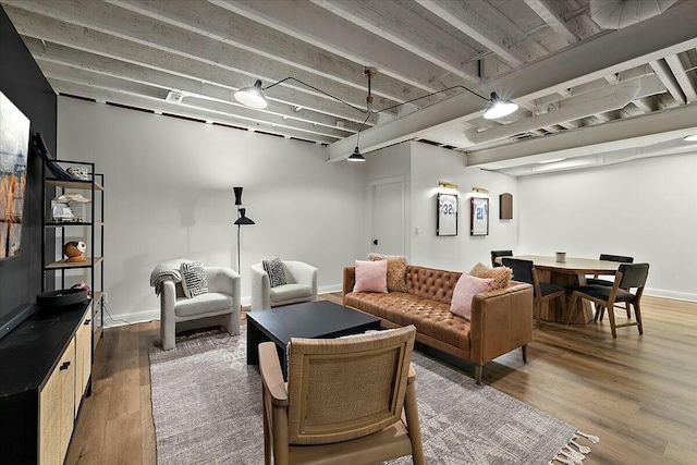 living room with baseboards and wood finished floors