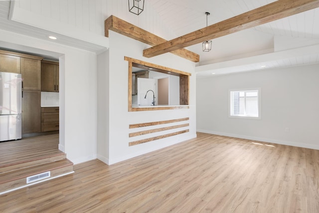 spare room with recessed lighting, baseboards, visible vents, and light wood-style floors