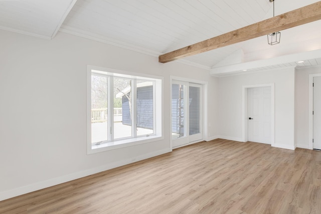 spare room featuring baseboards, lofted ceiling with beams, and light wood-type flooring
