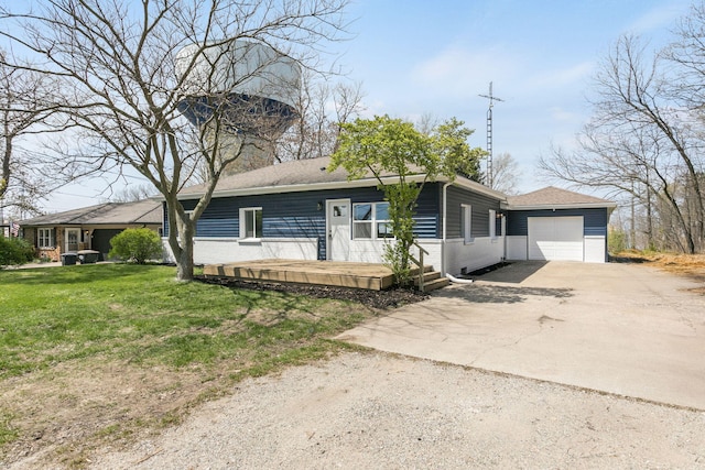 ranch-style home featuring brick siding, a garage, a front yard, and concrete driveway