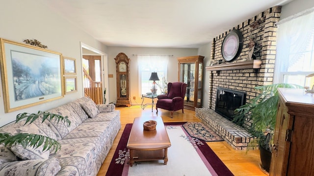 living area with wood finished floors and a fireplace