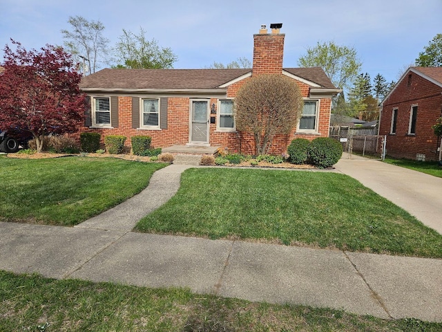 view of front facade with brick siding, a front lawn, roof with shingles, and a chimney